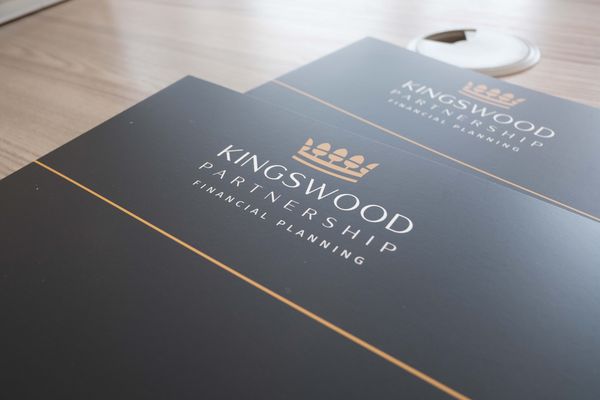 A branded Kingswood Partnership document folder